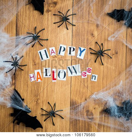 Happy Halloween Letters Cut Out From The Magazines, Bats, Web And Black Spiders