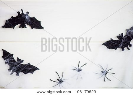 Halloween Symbols Bats, Web And Black Spiders On Wooden Background