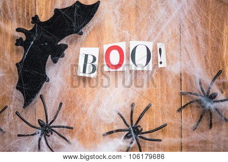Halloween Symbols Bats, Web And Black Spiders On Wooden Background
