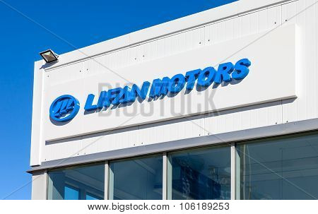 Lifan Motors Automobile Dealership Sign Against Blue Sky