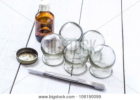 Old Medical Cupping Glass, The Alcohol In The Bubble, And Petrolatum Tweezers With Cottonwool