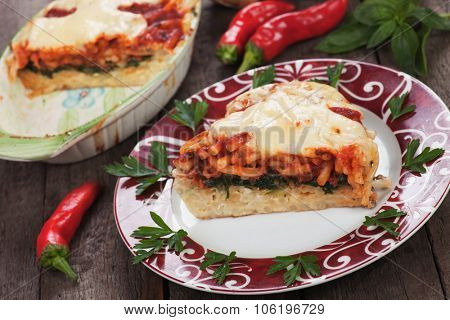 Pasticcio or pastitsio, baked pasta with cheese, chard and tomato sauce