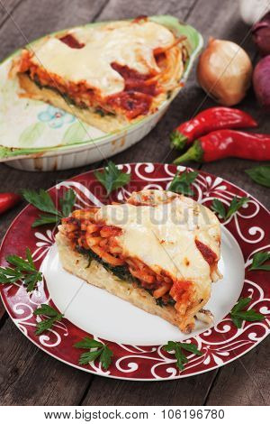 Pasticcio or pastitsio, baked pasta with cheese, chard and tomato sauce