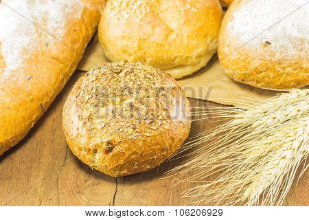 Bread And Wheat On The Wood Background, Warm Toning, Selective Focus
