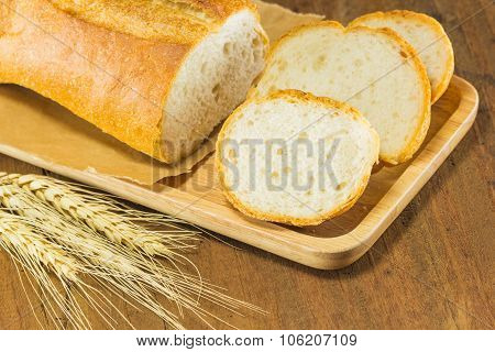 Bread And Wheat On The Wood Background, Warm Toning, Selective Focus