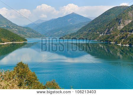 Zhinvali reservoir lake landscape with mountains . The main Caucasus ridge.