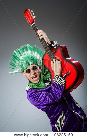 Funny man playing guitar in musical concept