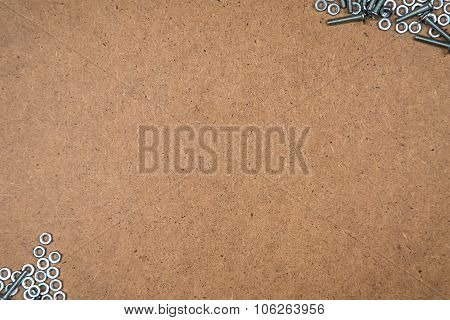 Nuts and bolts on fibreboard
