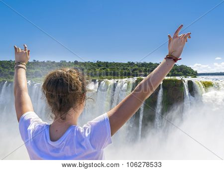 Young Woman With Hands Up At Devil Throat Falls