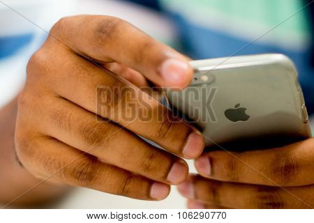 Closeup of hands holding iphone 6