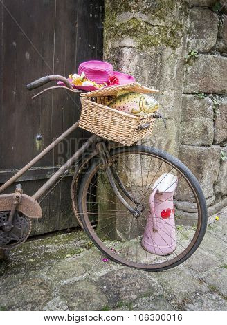 Rusty Bicycle Leaning Against Old Wooden Gate
