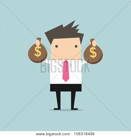Businessman holding money bag in hands