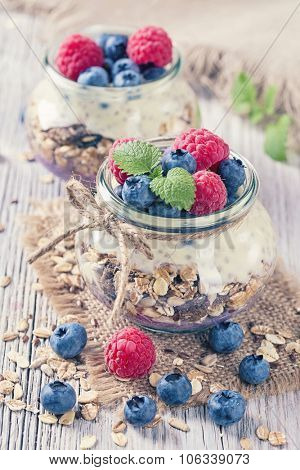 Chia seeds pudding with raspberries and blueberries