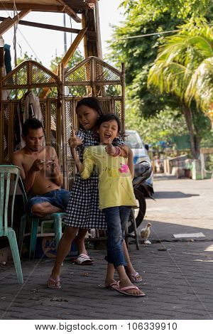 Indonesian Girls With Family In Manado Shantytown