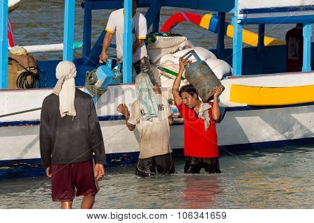 Men Transports Cargo From Ship