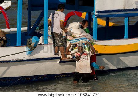 Men Transports Cargo From Ship