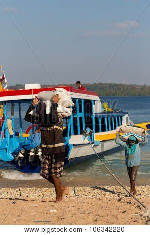 Men Transports Cargo From Ship