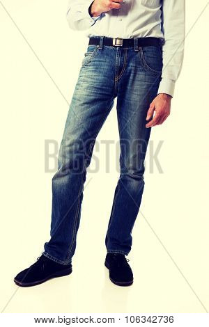 Full length of a men in jeans trousers. 
