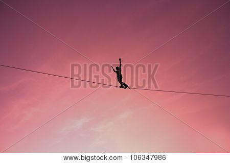 Men Balancing on Slackline