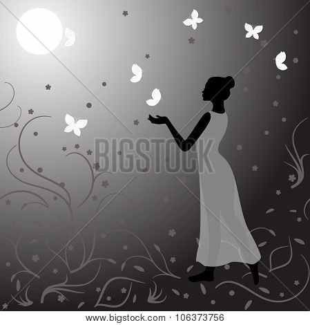 Girl clothed in gauzy dress in night with butterflies