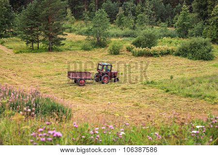 Old tractor standing in a field.