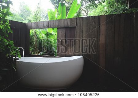 white bathtub in outdoor bath