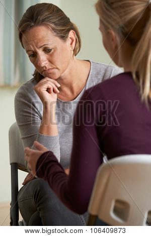 Mature Woman Discussing Problems With Counselor