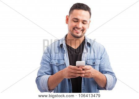 Attractive Man Using A Smartphone