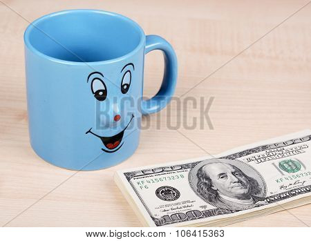 Cup and dollar. The cup is looking for dollars