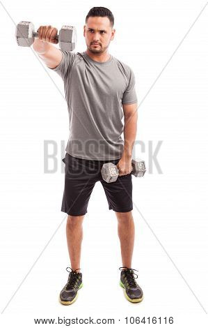 Man Working On His Deltoid Muscles