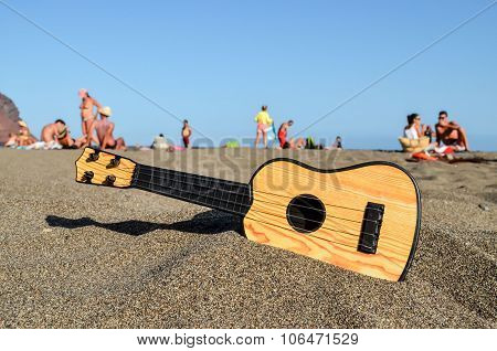 Guitar on the Sand Beach