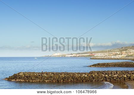 Stone Breakwaters On The Playa De Las Americas, Tenerife