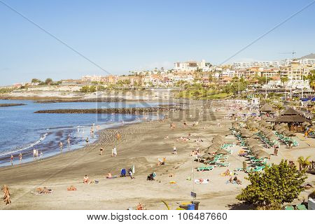 Sandy Beach With Thatched Parasols And Sunbeds, Costa Adeje, Tenerife, Spain