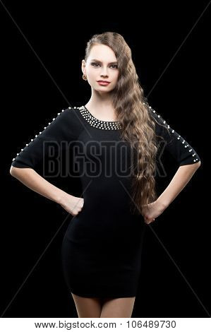 Portrait of beautiful brunette woman in black dress.