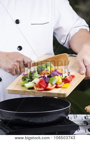 Chef Putting Vegetable To The Pan