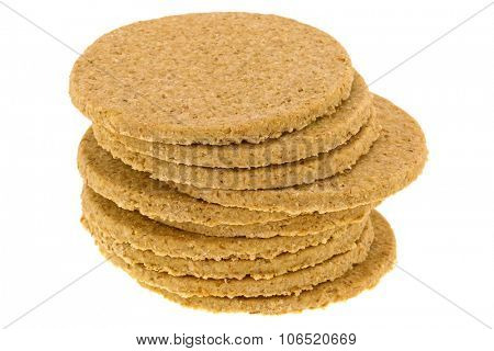 A stack of gluten free crumbly rough Oatcakes, isolated on white background