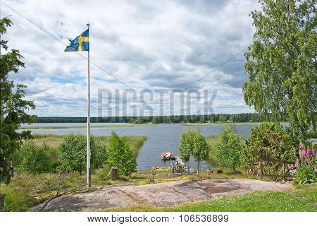 Swedish flag flying on pole