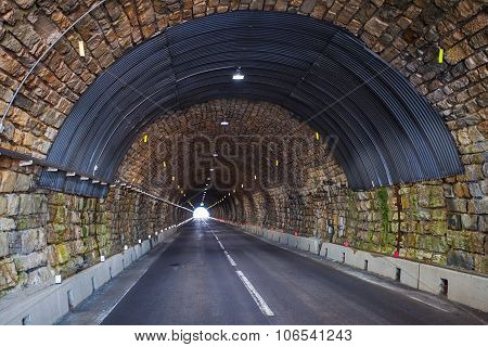 Road tunnel in alpine mountains