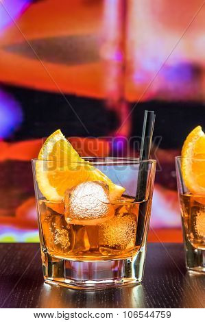 Glasses Of Spritz Aperitif Aperol Cocktail With Orange Slices And Ice Cubes On Bar Table, Color Pop