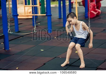 Sad Boy At Playground