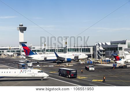 Air Traffic Control Tower And Terminal 4 With Air Planes At The Gates In Jfk Airport