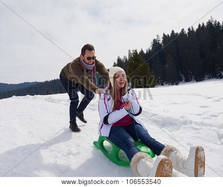 romantic winter  scene, happy young couple having fun on fresh show on winter vacatio, mountain nature landscape