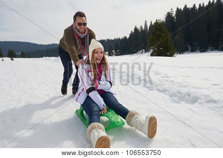 romantic winter  scene, happy young couple having fun on fresh show on winter vacatio, mountain nature landscape