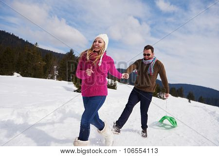romantic winter  scene, happy young couple having fun on fresh show on winter vacatio, mountain nature landscape