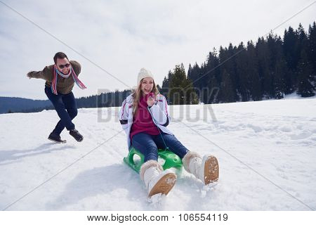 romantic winter  scene, happy young couple having fun on fresh show on winter vacatio, mountain nature landscape