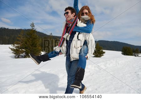 romantic winter  scene, happy young couple having fun on fresh show on winter vacatio, mountain nature landscape