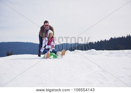 romantic winter  scene, happy young couple having fun on fresh show on winter vacatio, mountain nature landscape