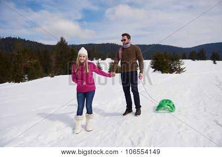 romantic winter  scene, happy young couple having fun on fresh show on winter vacatio, mountain nature landscape