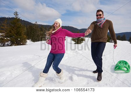 romantic winter  scene, happy young couple having fun on fresh show on winter vacatio, mountain nature landscape