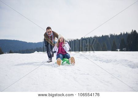 romantic winter  scene, happy young couple having fun on fresh show on winter vacatio, mountain nature landscape